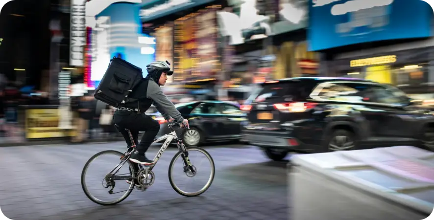 Cyclist navigating busy city streets. Cyclist navigating busy city streets.