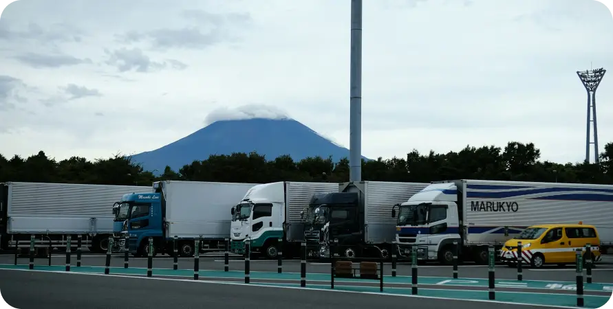 Trucks parked with mountain backdrop. Trucks parked with mountain backdrop.