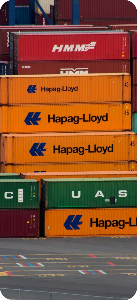 Stacked shipping containers in various colors Stacked shipping containers in various colors
