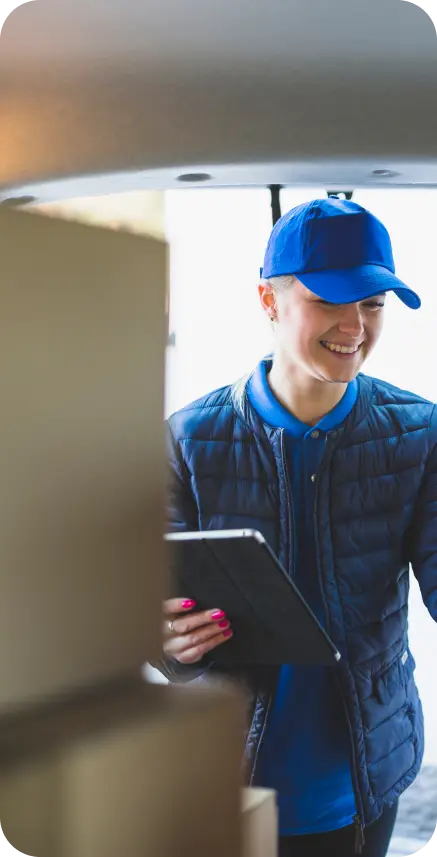 Delivery person with packages and tablet. Delivery person with packages and tablet.