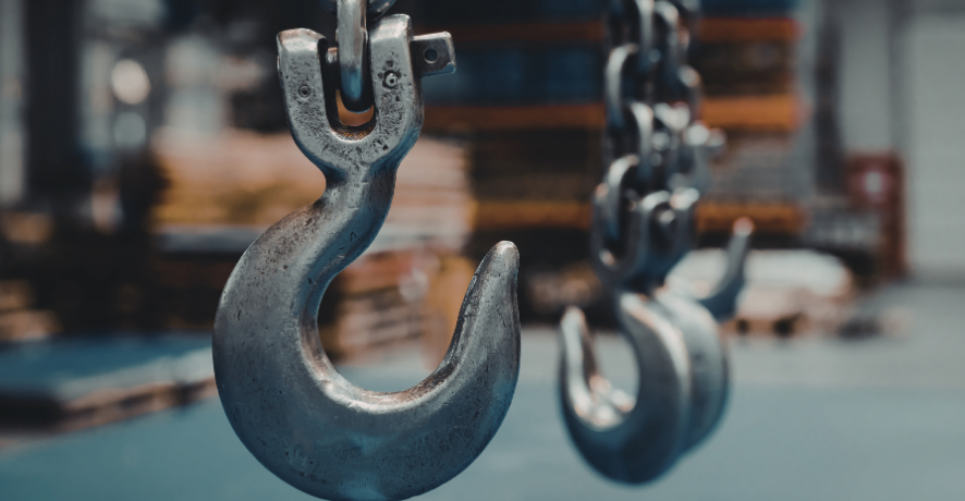 4 Metal hooks hanging in warehouse